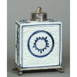 A silver mounted Chinese blue and white porcelain tea caddy The removable lid with lion mask finial,