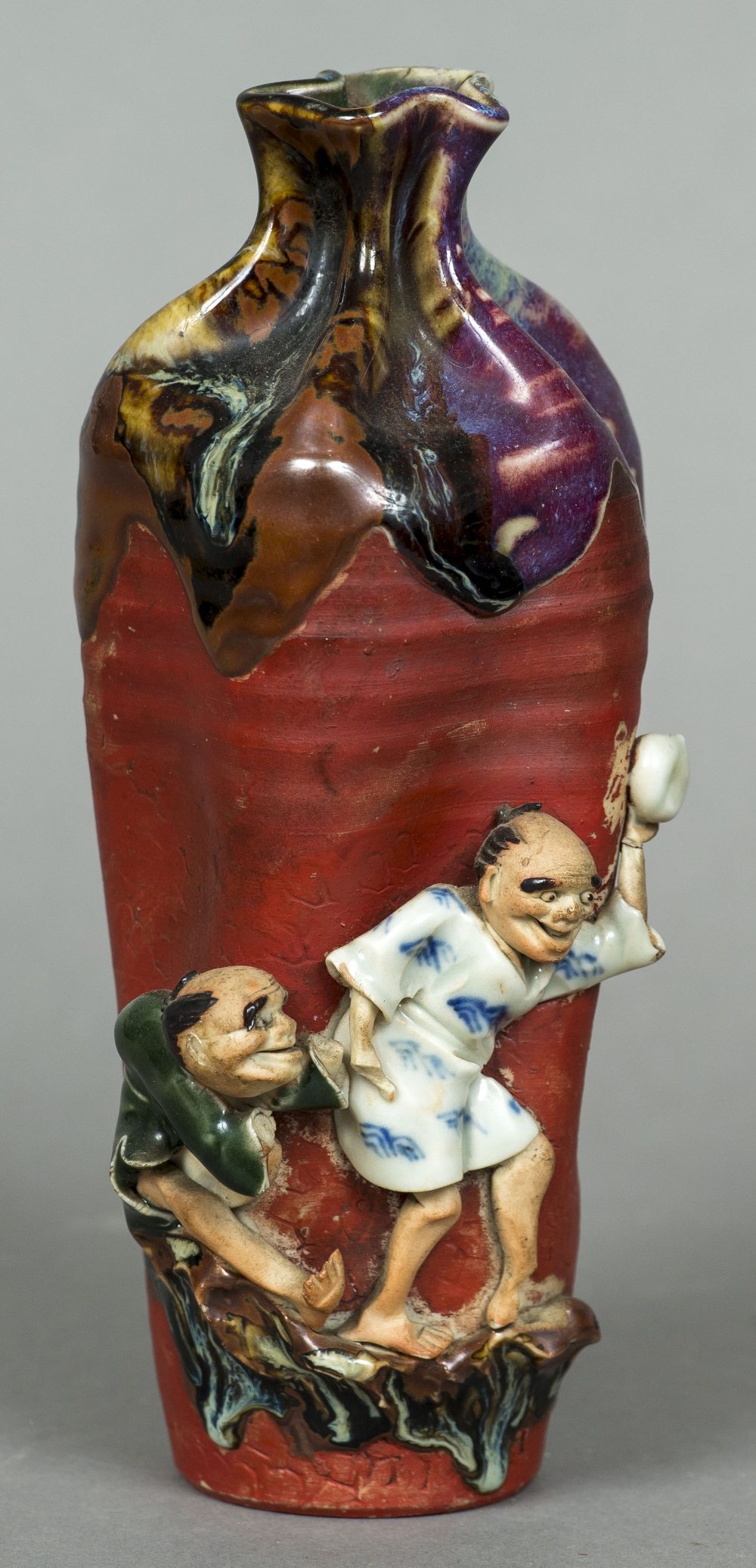 A Japanese Studio pottery vase Of crimped form, with applied figures,