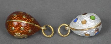 Two Russian enamelled egg charms One worked with polychrome polka dots,