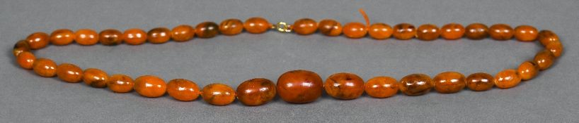 An amber bead necklace Of typical graduated form. 75.5 cm long.