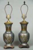 A pair of Chinese brass mounted pewter table lamps Each of vase form and decorated with a band of