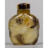 A Chinese carved shadow agate snuff bottle and stopper Worked with monkeys and birds in a tree,