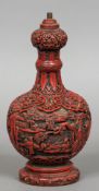 A Chinese red cinnabar lacquered on wood lamp base Worked with figures in a mountainous landscape