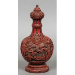 A Chinese red cinnabar lacquered on wood lamp base Worked with figures in a mountainous landscape