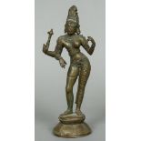 A patinated bronze model of an Indian three-armed deity Modelled standing wearing a headdress.