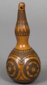 A carved double gourd Decorated with geometric decorations, the top with pierced suspension hole.