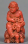 An Italian carved coral figurally group, possibly 18th century Formed as a putto riding a goat. 5.