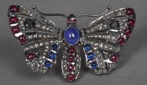 An unmarked gold and 925 silver diamond and ruby set brooch Formed as a butterfly,