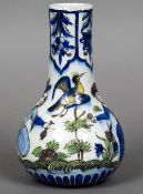 A 19th century Qajar vase The trailing floral and lappet decorated elongated neck above the bulbous