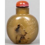 A Chinese carved shadow agate snuff bottle and stopper Worked with the figure of a bird. 6 cm high.