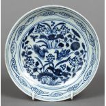 A Chinese blue and white porcelain saucer Decorated with Mandarin ducks amongst aquatic plants and