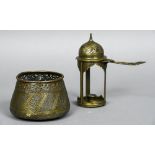 A 19th century Islamic brass chamberstick Of hinged domed lidded form;