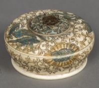 A late 19th century Chinese carved and stained ivory box and cover Of domed circular form,