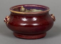 A Chinese porcelain censor Of typical form with allover ox blood glaze. 13 cm wide.