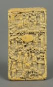 A 19th century Canton carved ivory card case Of slender rectangular form,