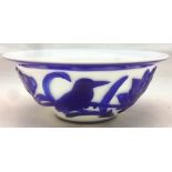 A Chinese Peking glass bowl Blue overlaid on white carved with a bird amongst lotus blossom. 15.