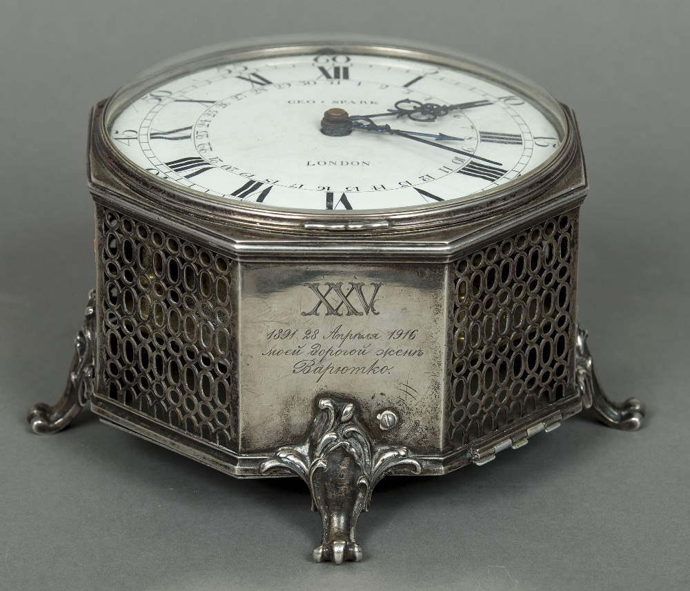 An unmarked silver cased desk timepiece The white enamelled dial with Roman and Arabic numerals