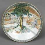 A Chinese porcelain charger Decorated with mischievous school children misbehaving whilst their