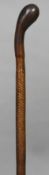 A 19th century leather cased walking cane 94.5 cm long.