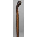 A 19th century leather cased walking cane 94.5 cm long.
