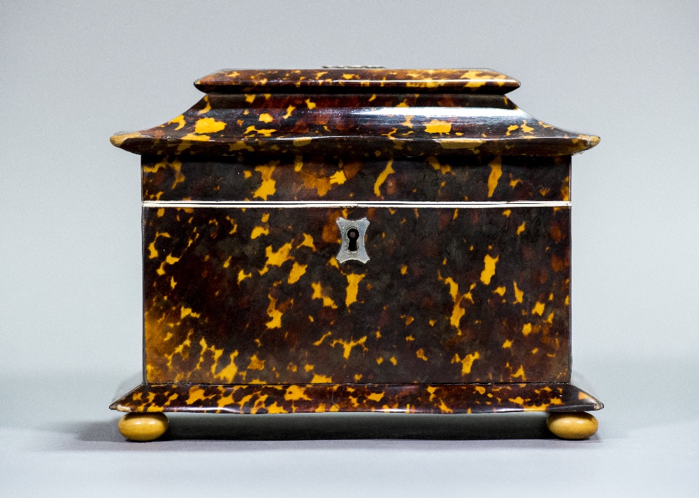 An early 19th century tortoiseshell tea caddy Of serpentine form,