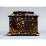 An early 19th century tortoiseshell tea caddy Of serpentine form,
