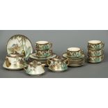 A twenty-one piece Satsuma tea set Decorated with pagodas amongst bamboo fronds.