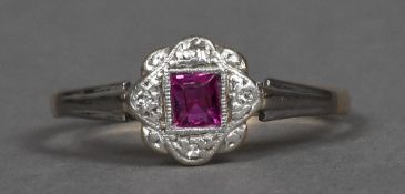 An 18 ct gold and platinum square cut ruby and diamond set ring CONDITION REPORTS: