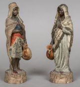 A pair of 19th century Continental terracotta figures Modelled as North African water carriers and