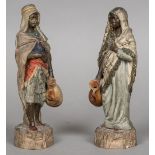 A pair of 19th century Continental terracotta figures Modelled as North African water carriers and