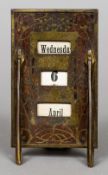 An Art Nouveau wooden inset brass desk calendar With stylised foliate decorations. 17.5 cm high.