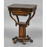 A 19th century Gothic Revival rosewood work table The shaped hinged top enclosing a fitted interior