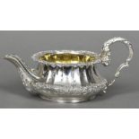 A silver cream jug, hallmarked London 1824, maker's mark of William,