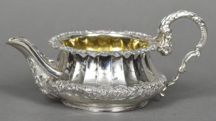 A silver cream jug, hallmarked London 1824, maker's mark of William,