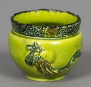 A 19th century Chinese green glazed bowl The florally decorated rim above the main body decorated