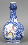 A Chinese porcelain vase Of baluster form, decorated with figural vignettes on lotus strapwork. 23.