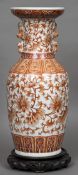A Chinese porcelain vase Decorated in red with lotus strapwork within lappet bands,