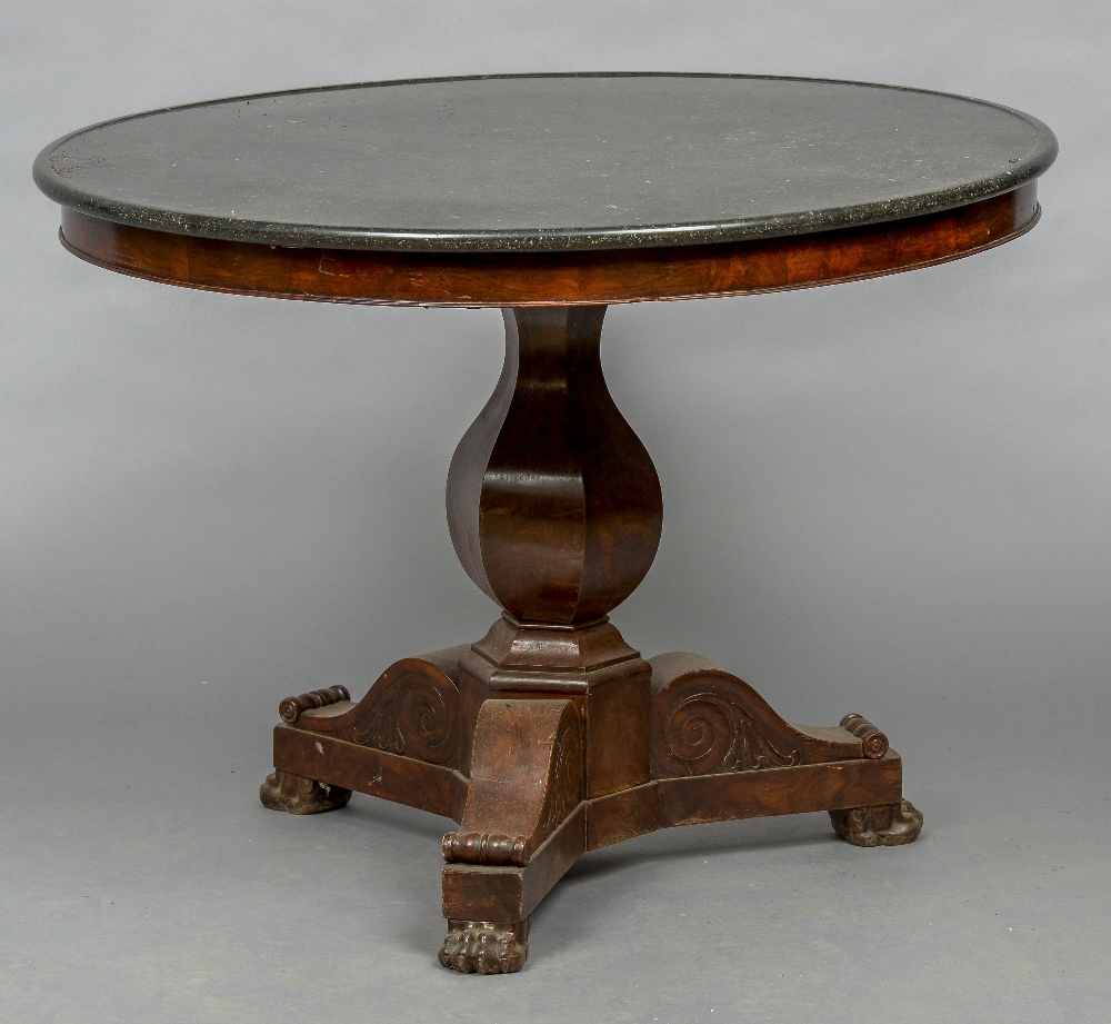 A 19th century marble topped mahogany tripod table The dished circular black variegated marble top