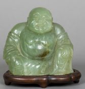 A carved jade model of Buddha Typically modelled seated,