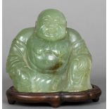 A carved jade model of Buddha Typically modelled seated,