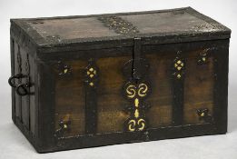 A 17th century iron and brass bound ships chest Of hinged rectangular form,