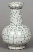 A Chinese crackle glaze pottery vase Of squat bulbous form, with elongated neck and flared top rim.