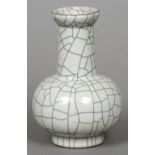 A Chinese crackle glaze pottery vase Of squat bulbous form, with elongated neck and flared top rim.