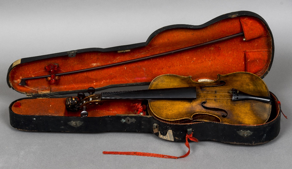 A 19th century violin With single piece back and lion carved stock; together with a bow,