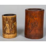 A Chinese carved bamboo brush pot Worked with calligraphic script opposing a bamboo spray;