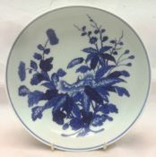 A Chinese blue and white porcelain bowl Centrally decorated with floral sprays,