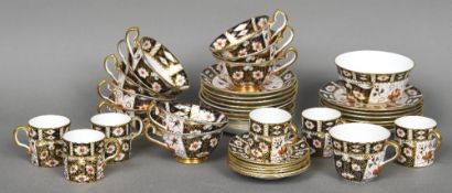 A quantity of Royal Crown Derby tea wares, pattern 2451 Comprising: six side plates, eleven saucers,