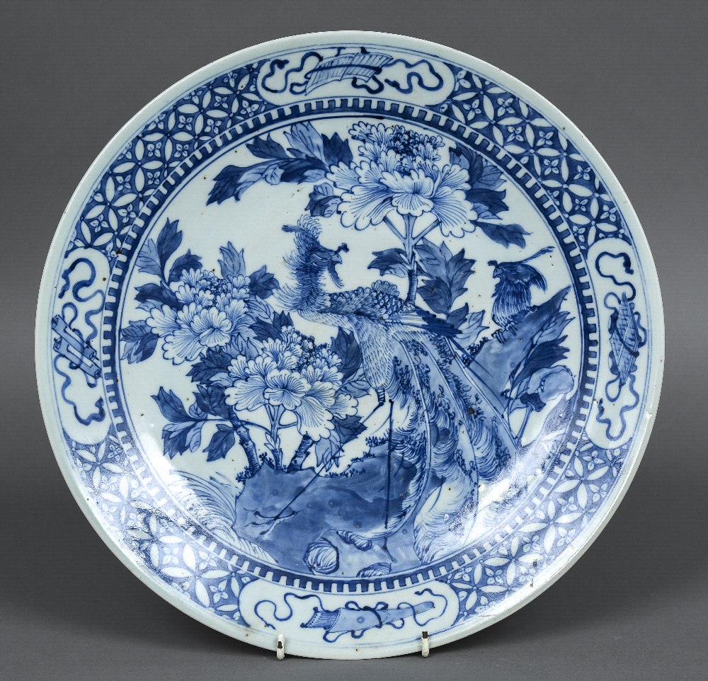 A 19th century Japanese blue and white charger Centred with birds amongst floral sprays. 37.