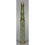 An 18th century shagreen covered brass mounted three drawer telescope 54 cm long extended.