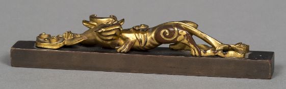 A Chinese carved giltwood model of a dragon,